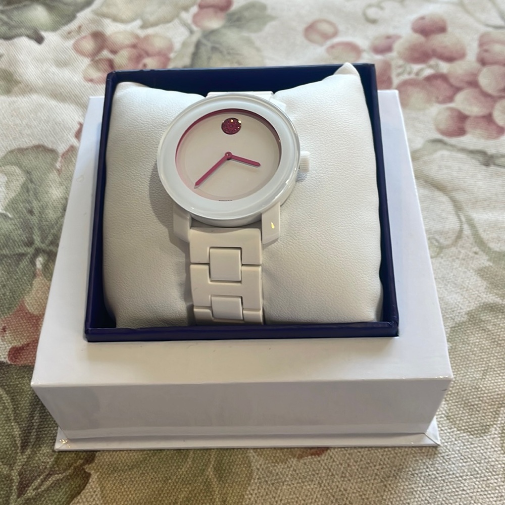 White Movado watch with pink detailing